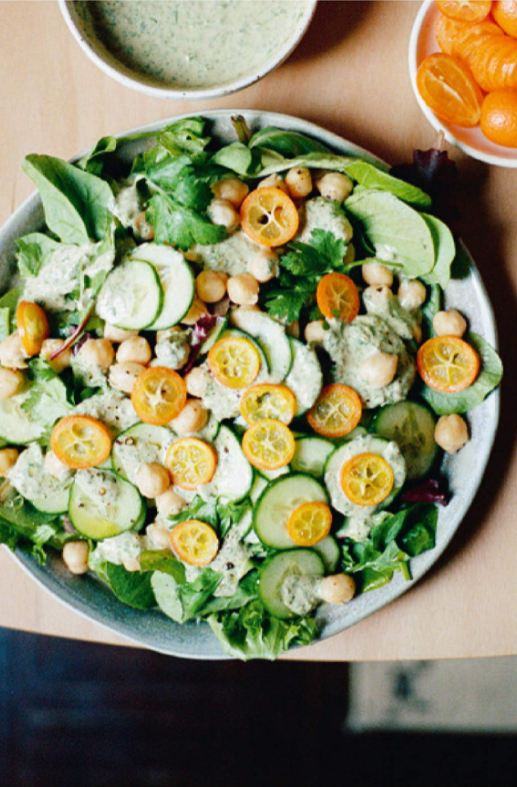 A green salad, with cumquats