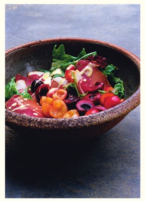 A salad of summer leaves, cured pork and cherries