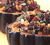Acorn squash stuffed with wild rice, cranberries, walnuts, and hickory-baked tofu