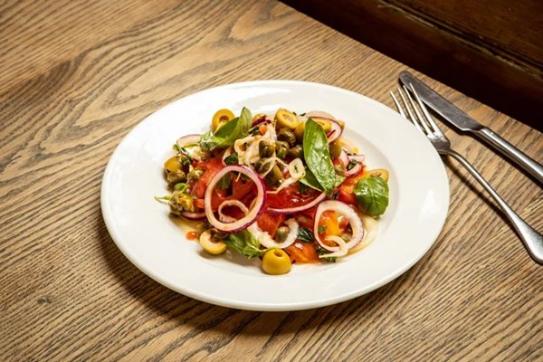 Aeolian-style salad with tomatoes, capers and anchovy-stuffed green olives