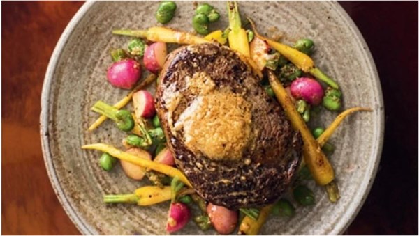 Aged beef steak with miso butter, broad beans, carrots and radishes