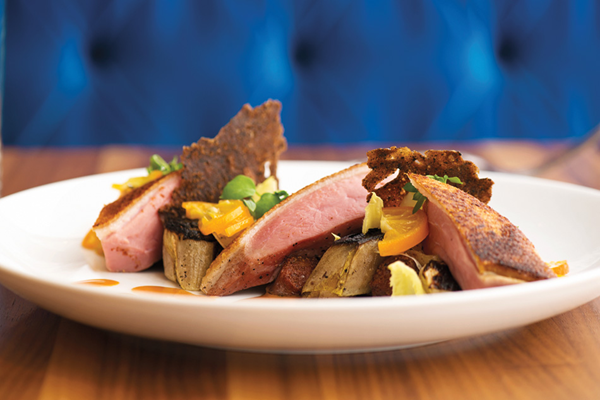 Aged Peking duck breast with chicory sausage, sweet potato jus, harissa & charred endives