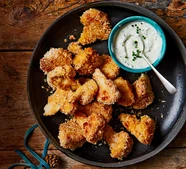 Air-fryer cauliflower popcorn with soured cream & herb dressing