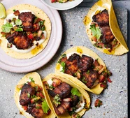 Air fryer sticky pork tacos with plum & chilli salsa