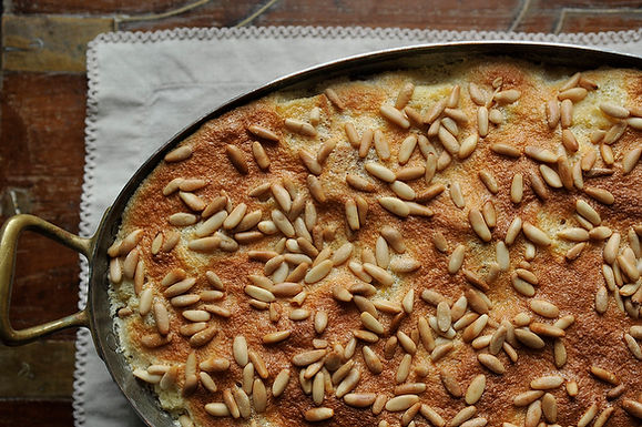 Airy rosemary citrus pignole bread pudding