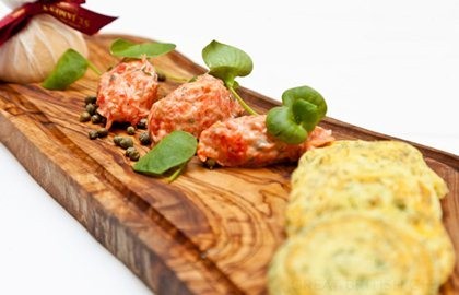 Alaska salmon rillettes with dill-scented potato pancakes, lemon and capers