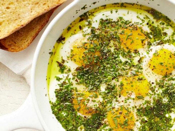Alice Waters' olive oil fried eggs with a crown of herbs