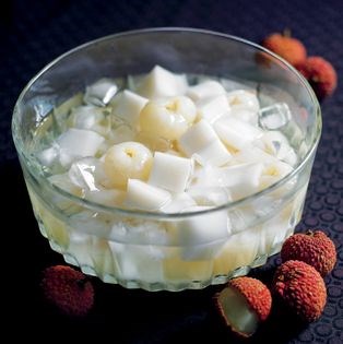 Almond jelly with lychees in syrup