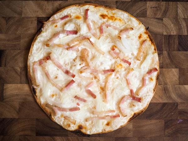 Alsatian pizza with fresh cheese, onions, and bacon (Bar-style tarte flambée)