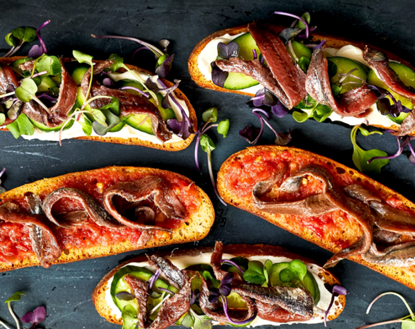 Anchovy toasts with fresh tomato vinaigrette