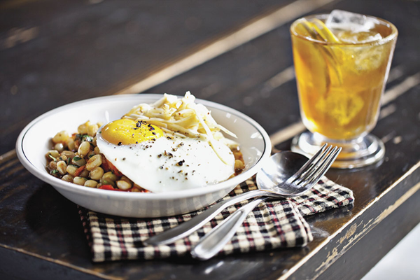 Anson Mills hominy with pig's trotters, celery root slaw & dippy egg