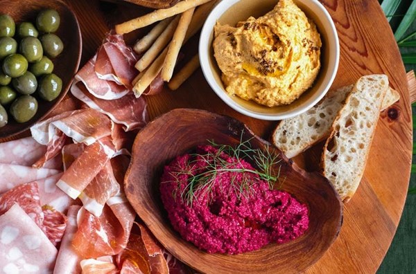 Antipasto platter with roast cumin kumara hummus & baby beetroot hummus
