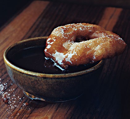 Apple cider beignets with butter-rum caramel sauce