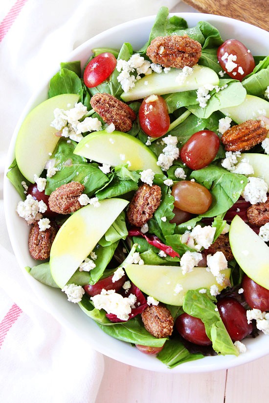 Apple, grape, and candied pecan salad with maple-mustard dressing