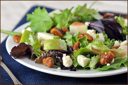 Apple salad with candied walnuts, blue cheese, and pomegranate vinaigrette