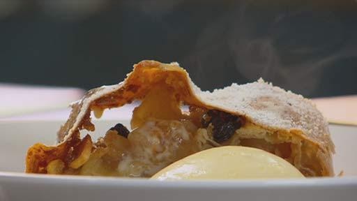 Apple strudel with cream and custard