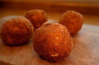 Arancini stuffed with mozzarella and ragu