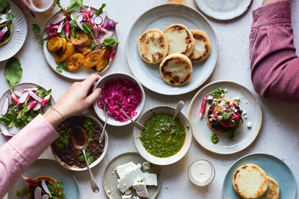 Arepas with black beans and salsa verde