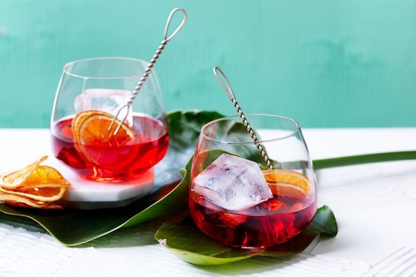 Aria negroni premix with oven-dried orange slices