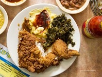 Arnold's country kitchen fried chicken, chicken livers, braised turnip greens, and fried green tomatoes
