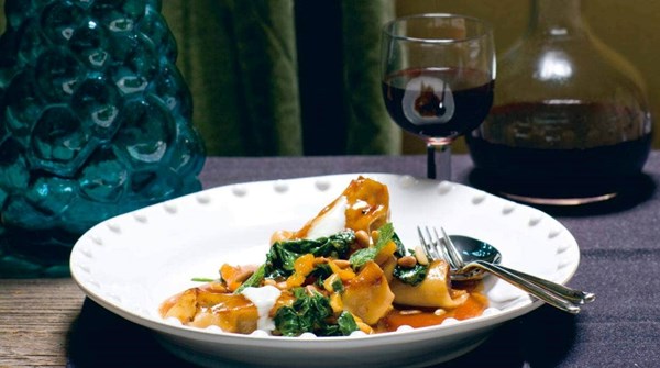 Aromatic lamb-stuffed pasta with apricots and spinach