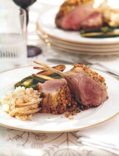 Artichoke and truffle-crusted rack of lamb with creamy white beans