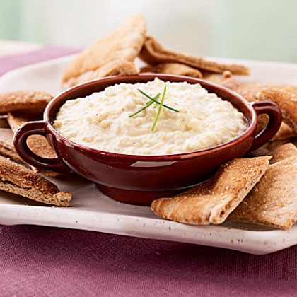 Artichoke, leek, and goat cheese dip with garlic pita chips