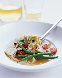 Artichokes simmered with green beans and bacon