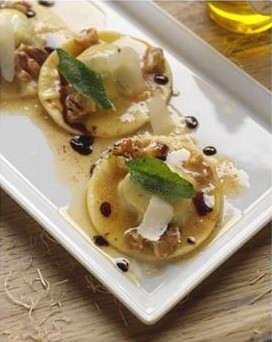 Arugula and goat cheese ravioli with walnut and sage butter sauce