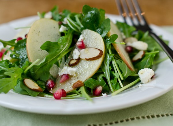 Arugula, apple, and pomegranate salad with cider-honey vinaigrette