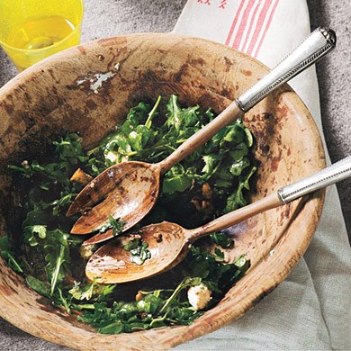 Arugula salad with caramelized onions, goat cheese, and candied walnuts