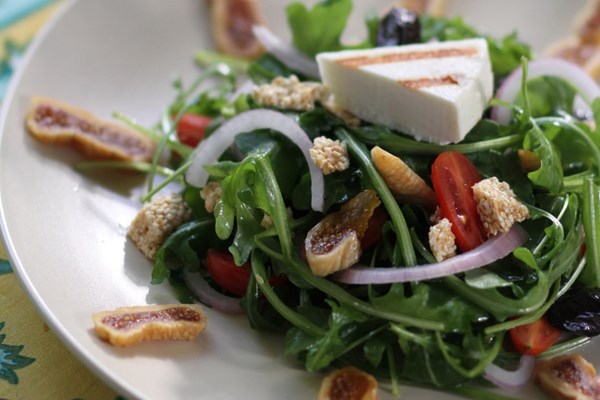 Arugula salad with dried figs, wrinkled olives, and pasteli (Roka salata me ksera syka, throumbes kai pasteli)