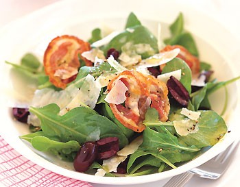 Arugula salad with olives, pancetta, and Parmesan shavings
