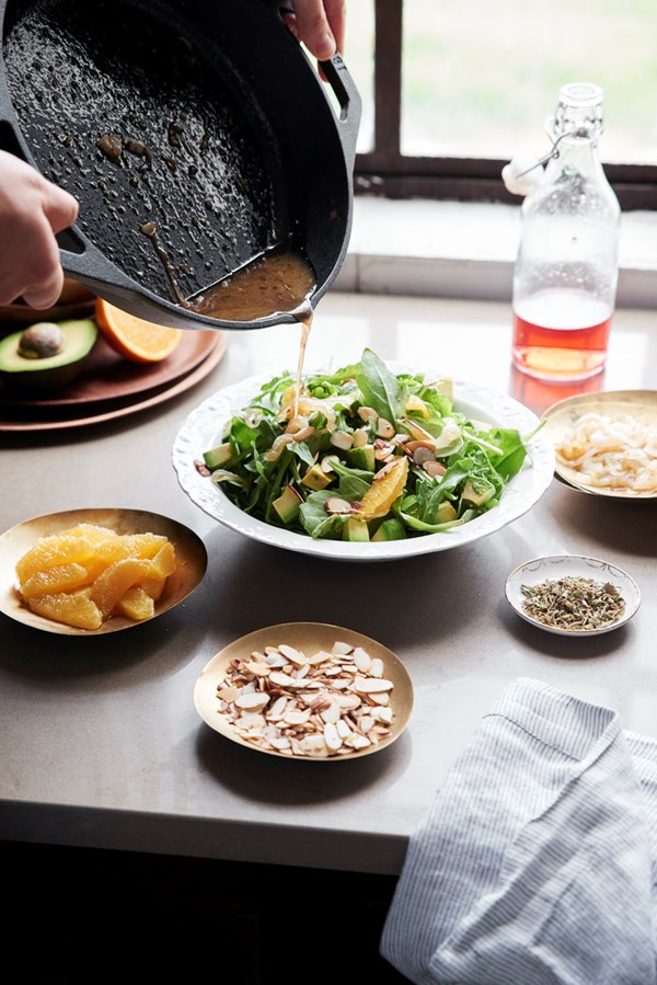 Arugula salad with orange, avocado, and sweet pan drizzle