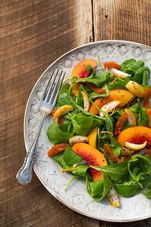Arugula with fresh golden Barhi dates, dried apricots, nectarines, and sumac