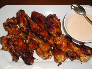 Asian lacquered wings with a honey Sriracha yogurt dipping sauce