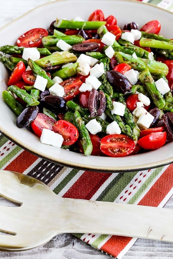 Asparagus salad with cherry tomatoes, olives, and feta