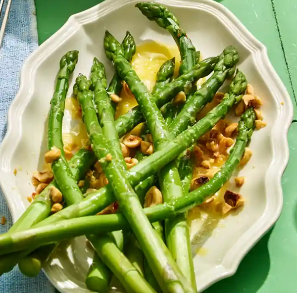 Asparagus with melted butter and toasted hazelnuts