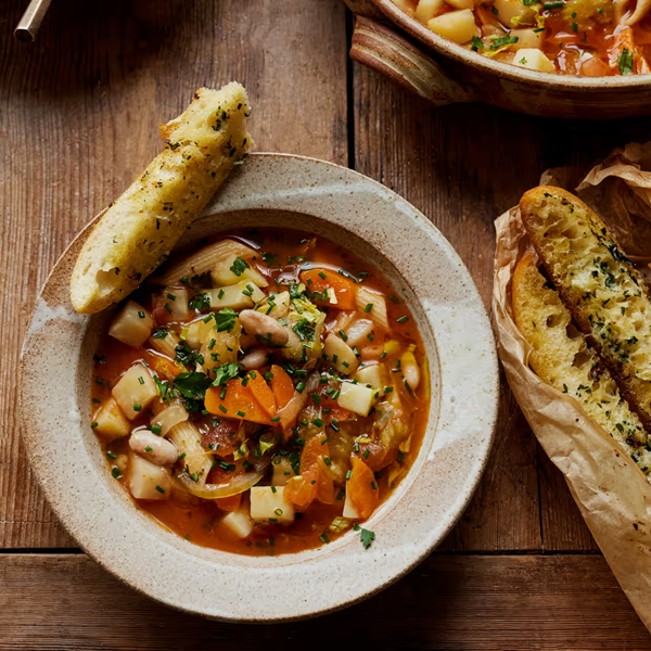 Autumn minestrone soup with garlic and parsley bread
