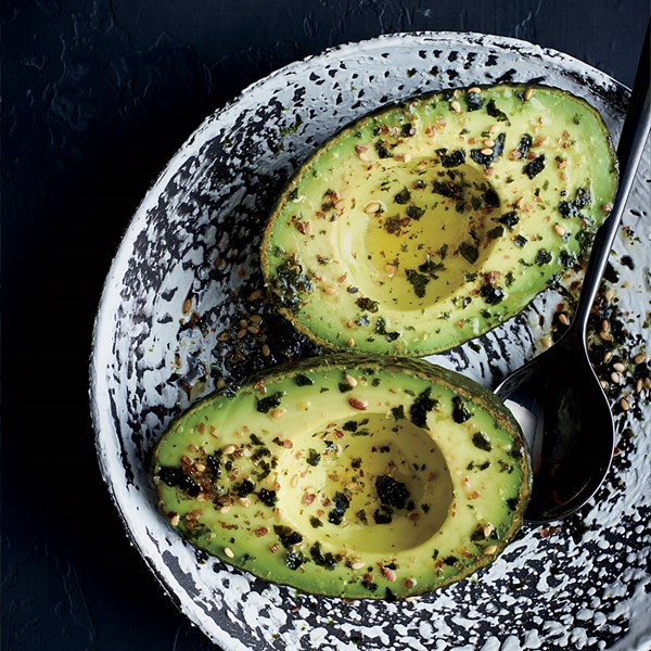 Avocado halves with flaxseed furikake