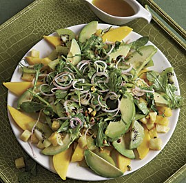 Avocado, mango, and pineapple salad with pistachios and pickled shallots