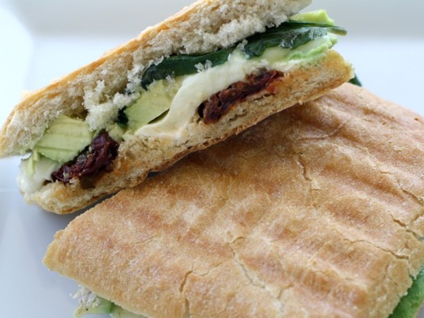 Avocado panini with Brie, mozzarella, sun dried tomatoes, and basil