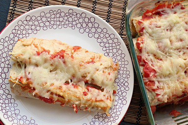 Avocado-stuffed tomato enchiladas