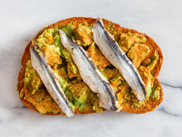 Avocado toast with boquerones and smoked paprika