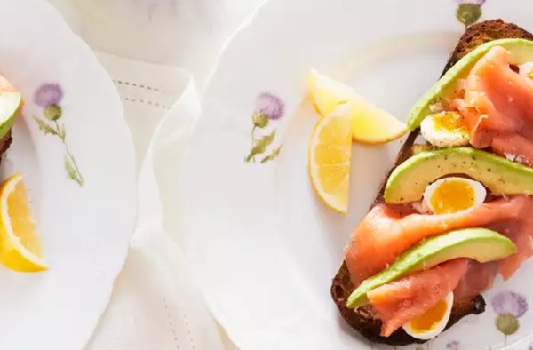 Avocado toast with poached quail eggs and smoked salmon