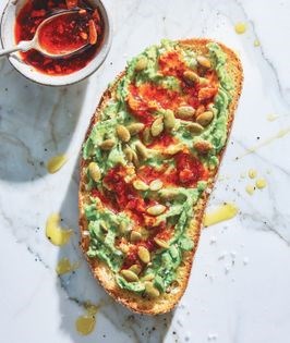 Avocado toast with toasted pepitas and chili crisp