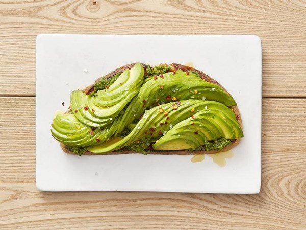 Avocado toasts with kale-pistachio pesto