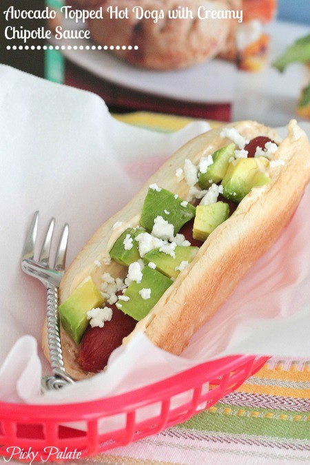 Avocado-topped hot dogs with cream chipotle sauce