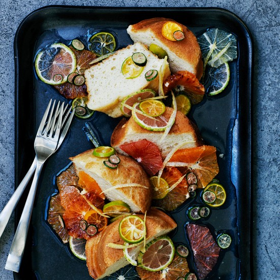 Babas au rhum with mixed citrus fruits