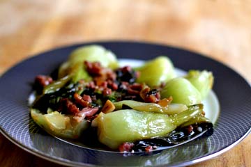 Baby bok choy with sherry and prosciutto